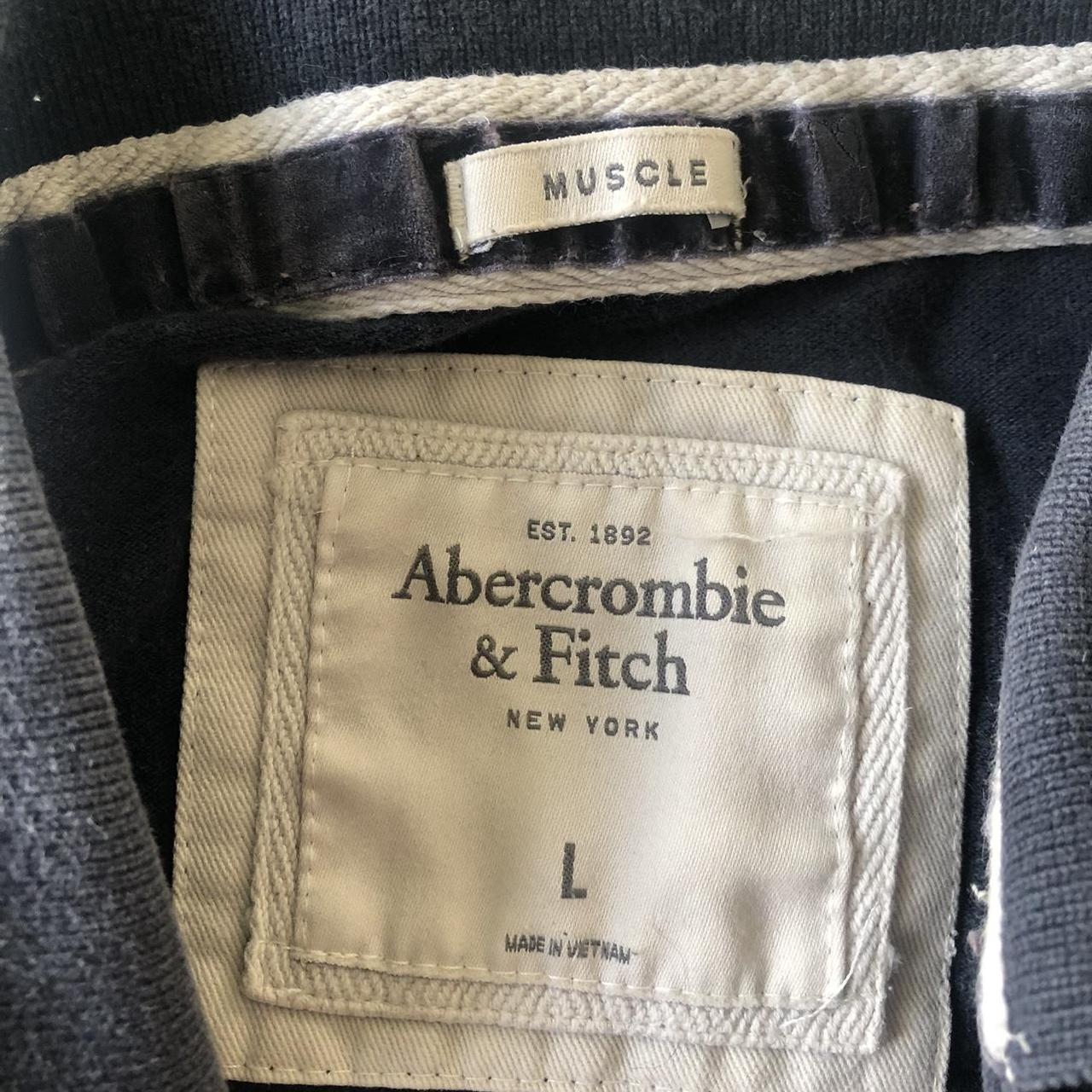 Abercrombie & Fitch Navy Polo Shirt. Slightly faded.... - Depop