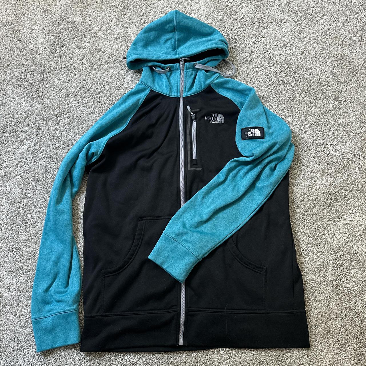 The North Face blue and black zip up hoodie