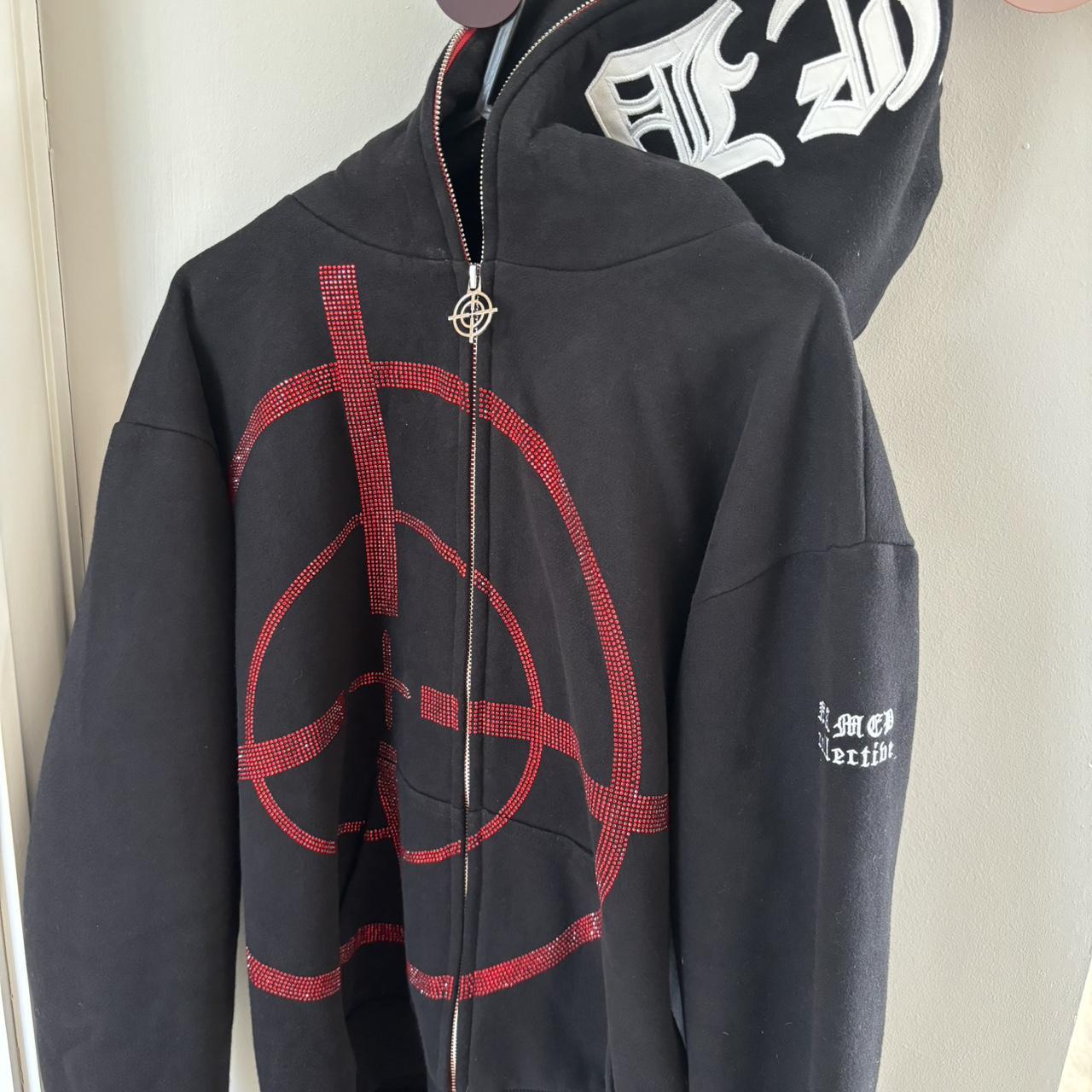 Black and red hoodie with a unique design. Depop