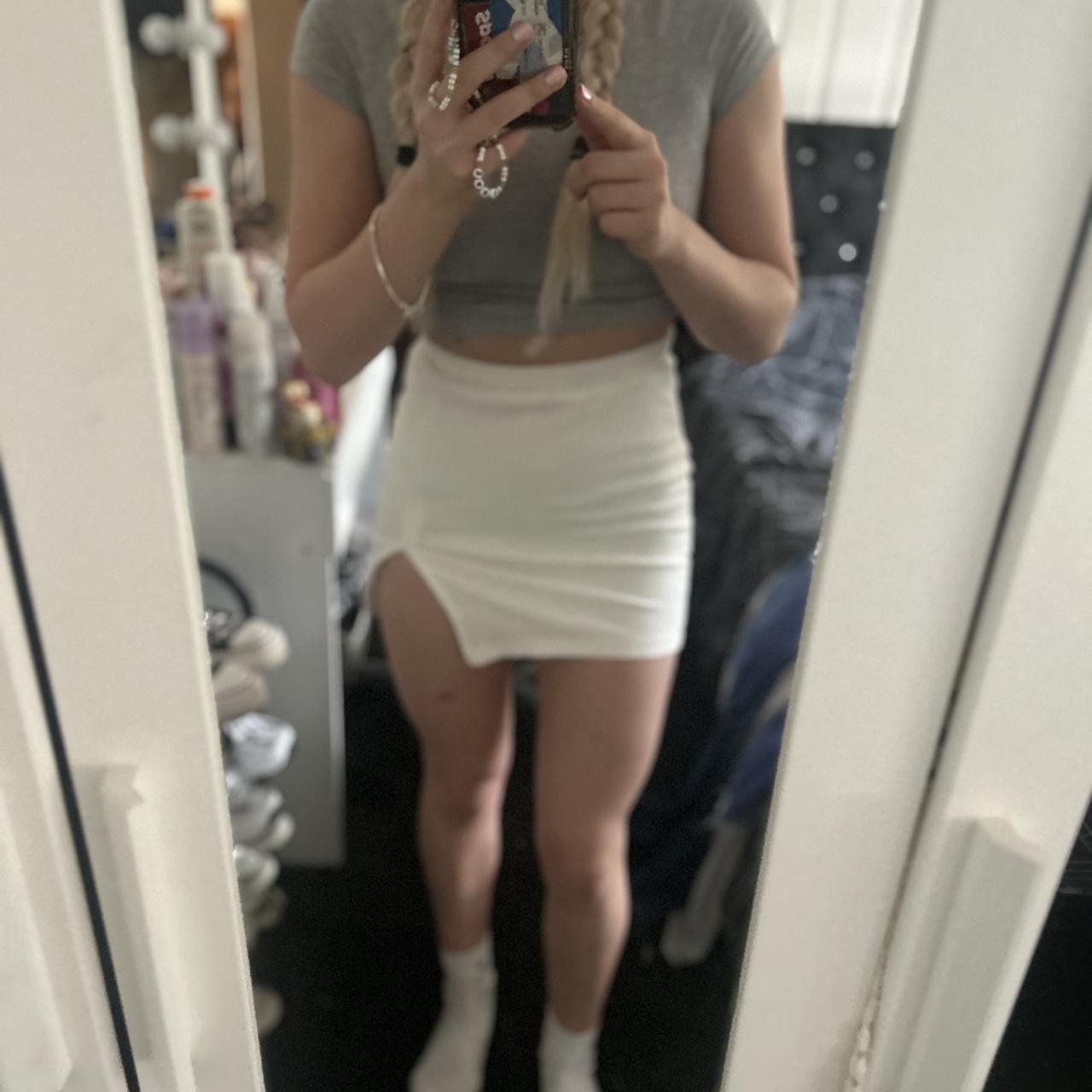 White slit mini skirt , never worn , would fit size... - Depop