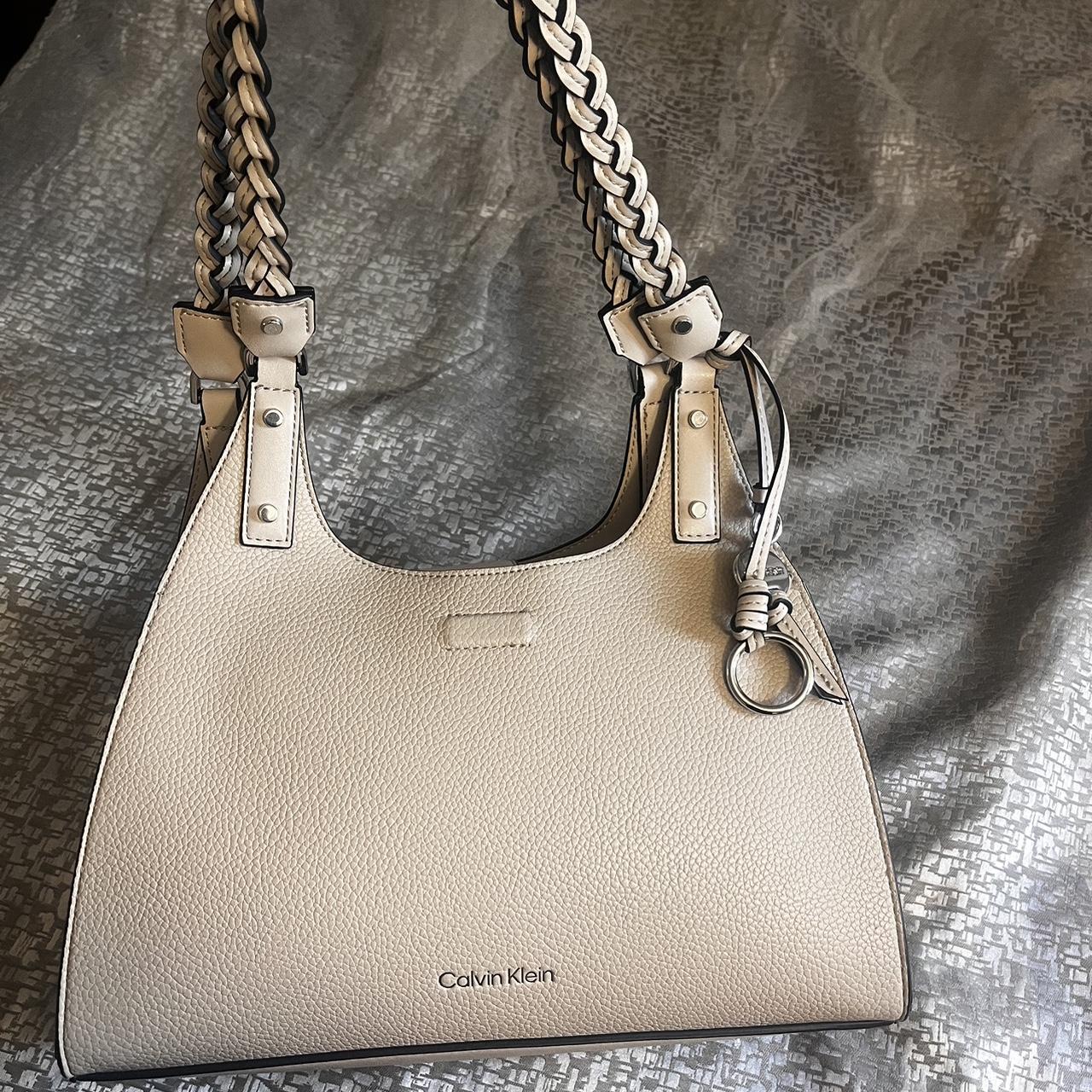 Calvin Klein light beige purse In good condition no. Depop