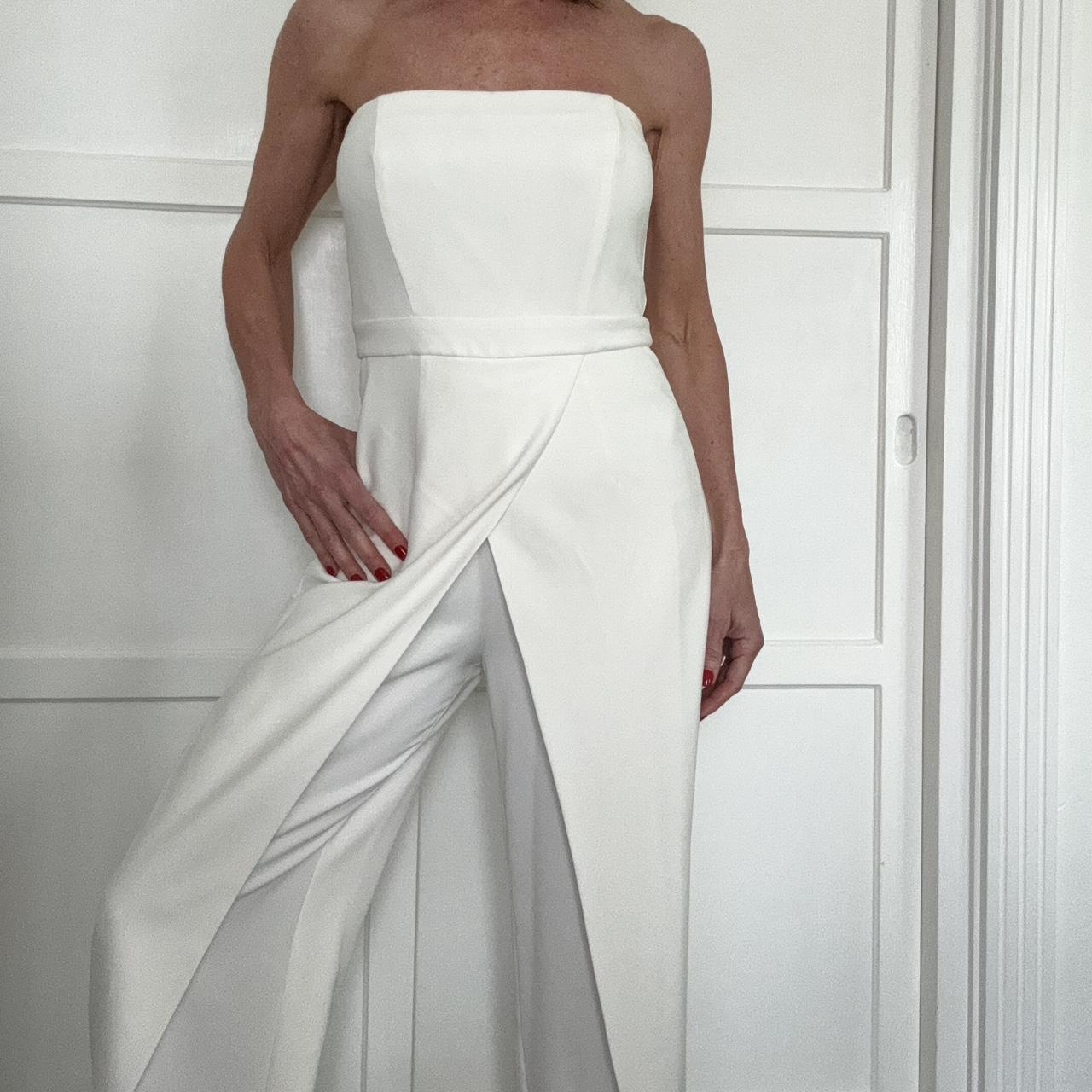 White House Black Market white jumpsuit. This is a... Depop