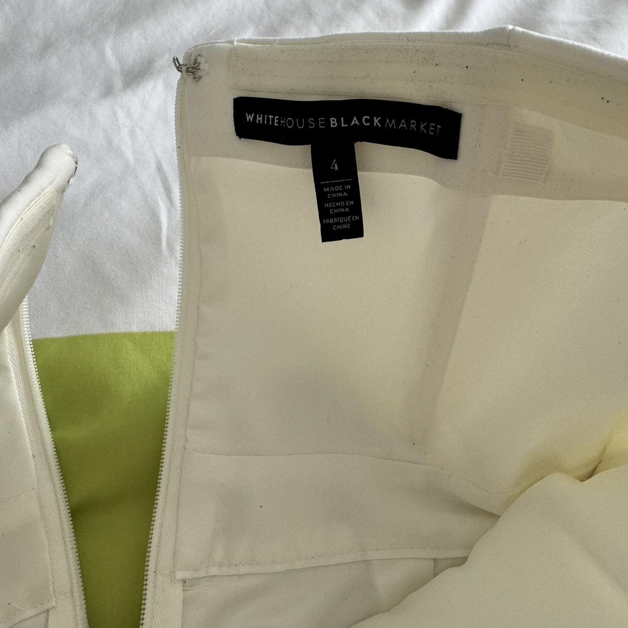 White House Black Market white jumpsuit. This is a... Depop