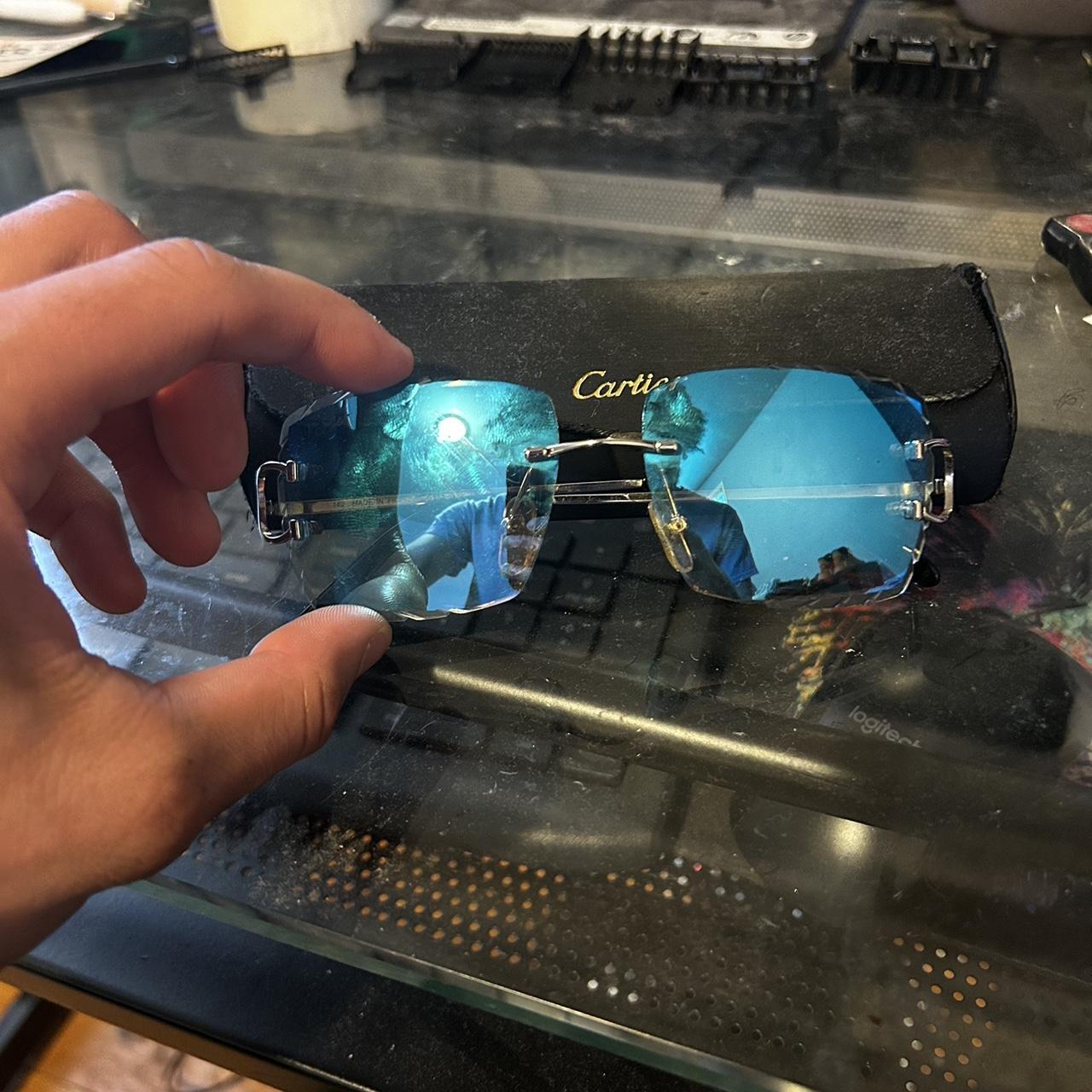 Cartier glasses with silver frames and blue