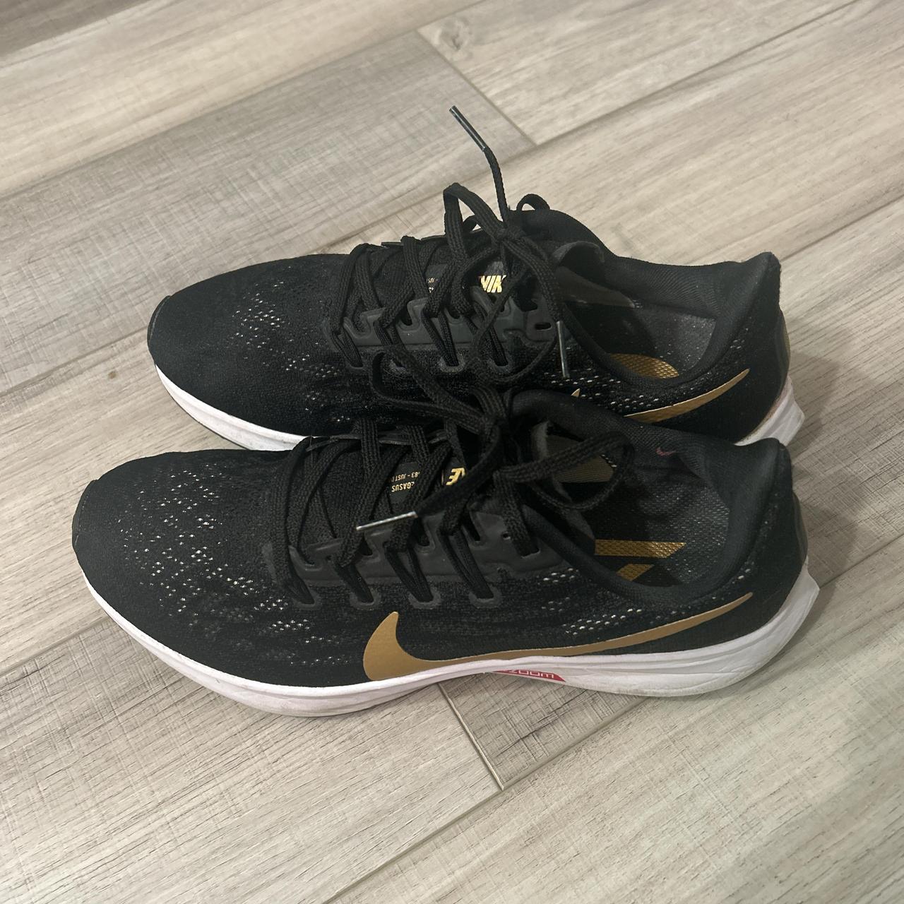 Black and gold Nike running shoes size 9 in women’s... - Depop