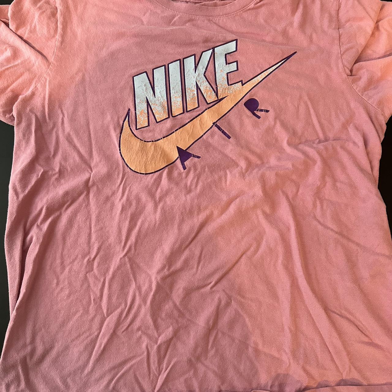 Women s Nike Pink Tee The paint on the shirt has