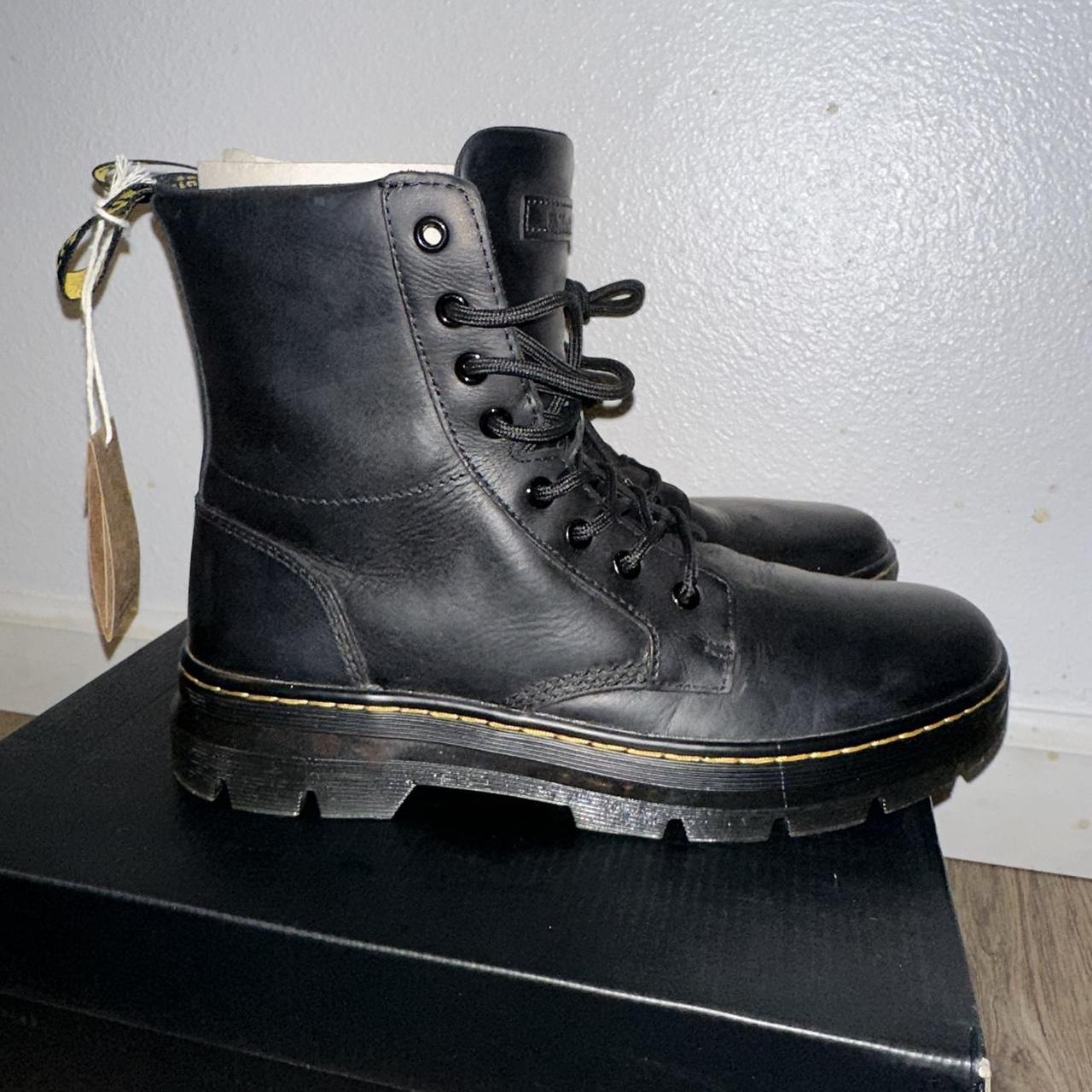 Dr. Martens black leather boots with yellow