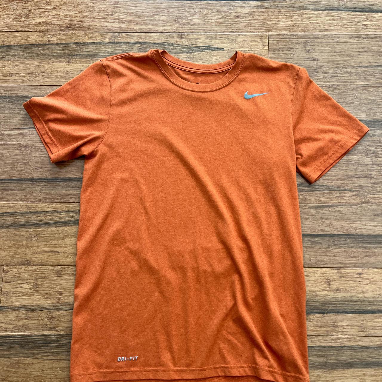 dark orange nike shirt