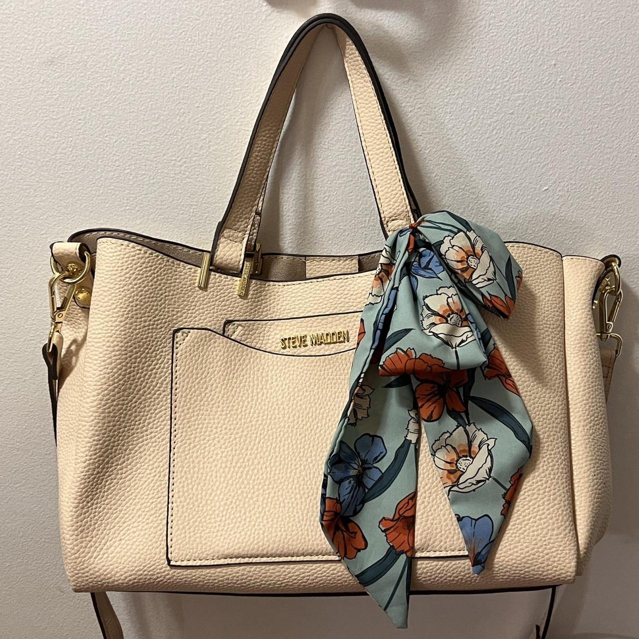Cream colored Steve Madden bag with floral