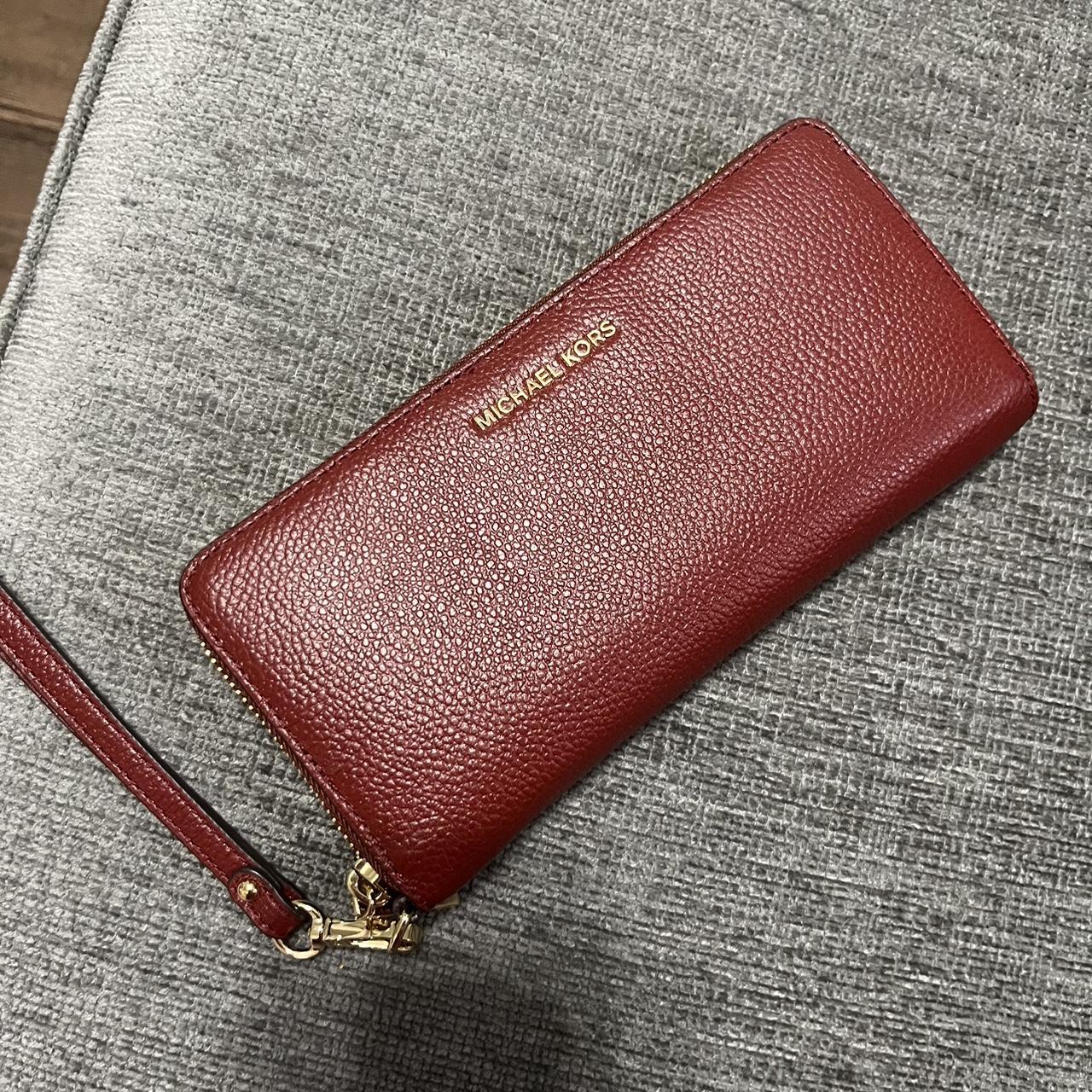 Red Michael Kors wallet with wrist band Brand new. Depop