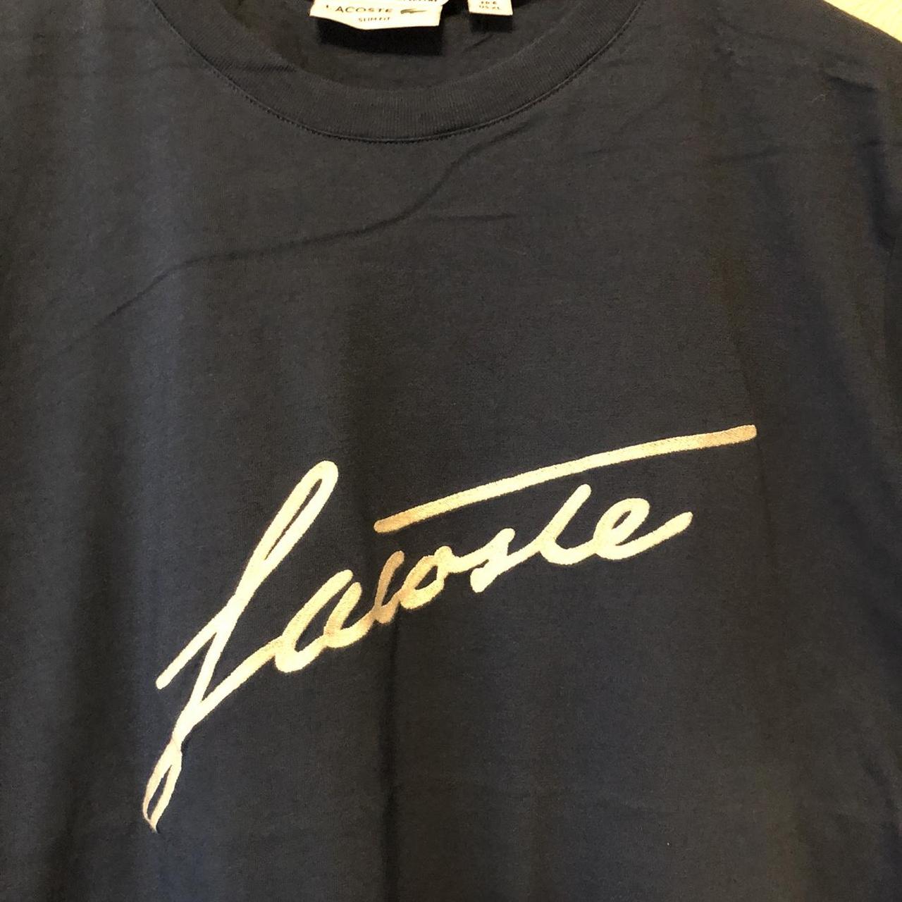Navy Lacoste signature t-shirt, XL/6. Worn once.... - Depop
