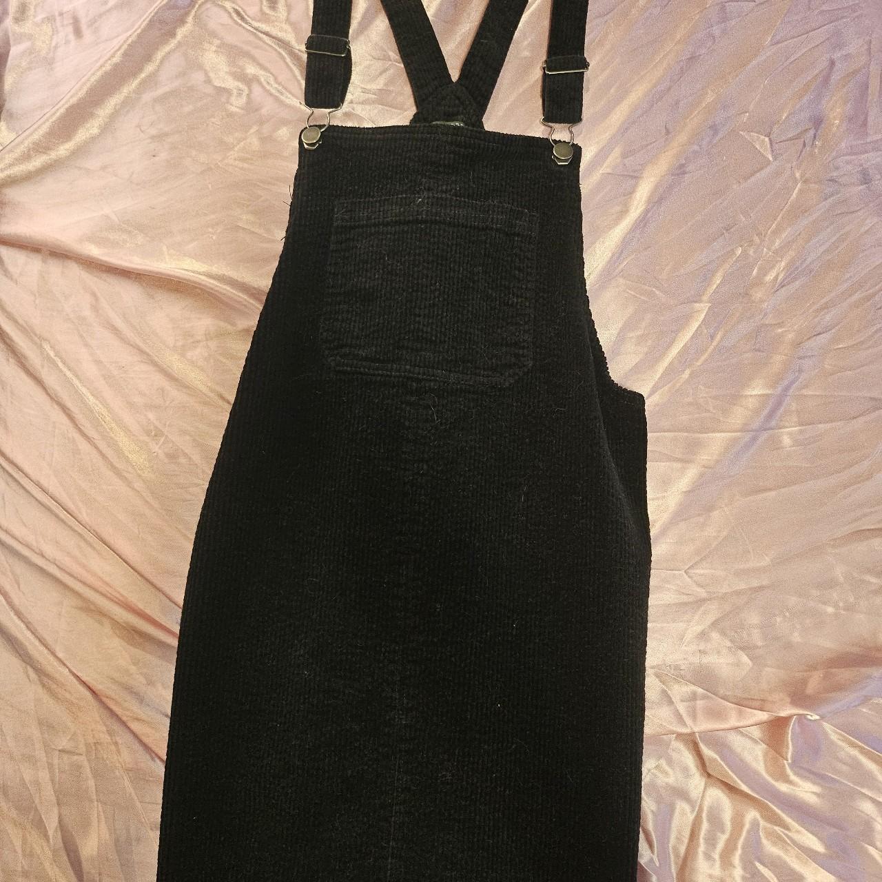 Black overall dress. It s between a small and medium. Depop