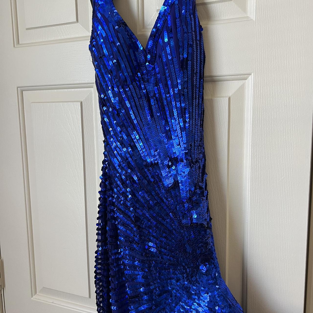 Blue sequin dress with a slit and halter top. Worn