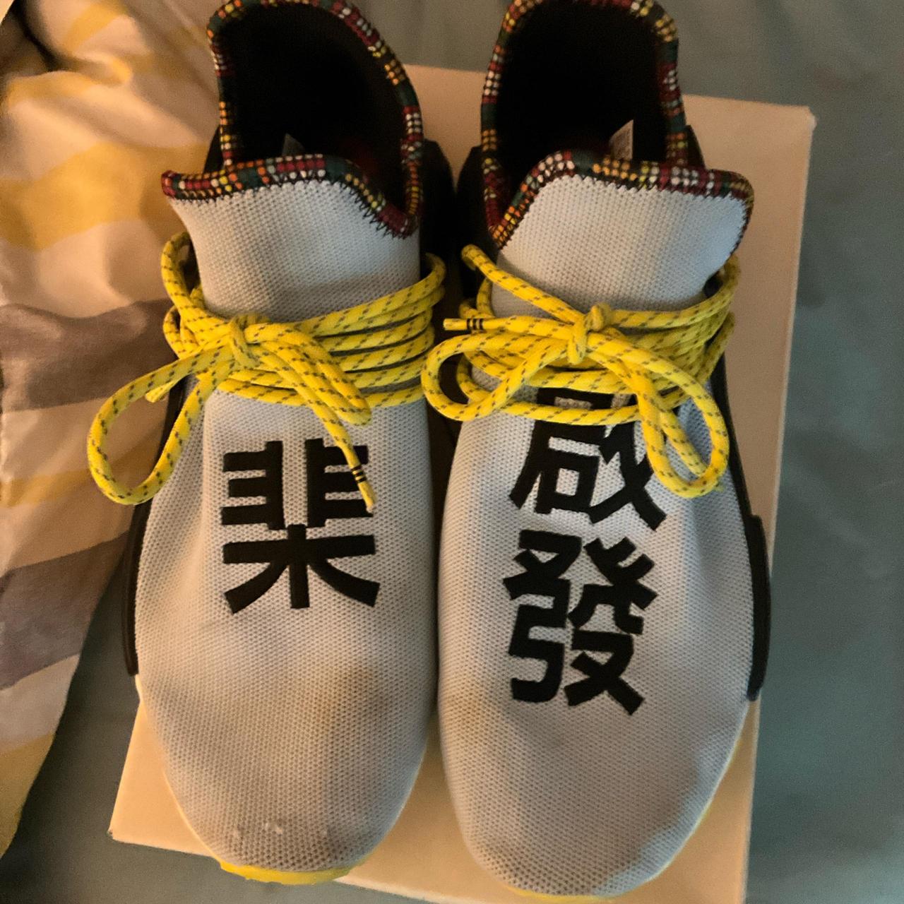 light blue adidas NMD w yellow bottoms comes w