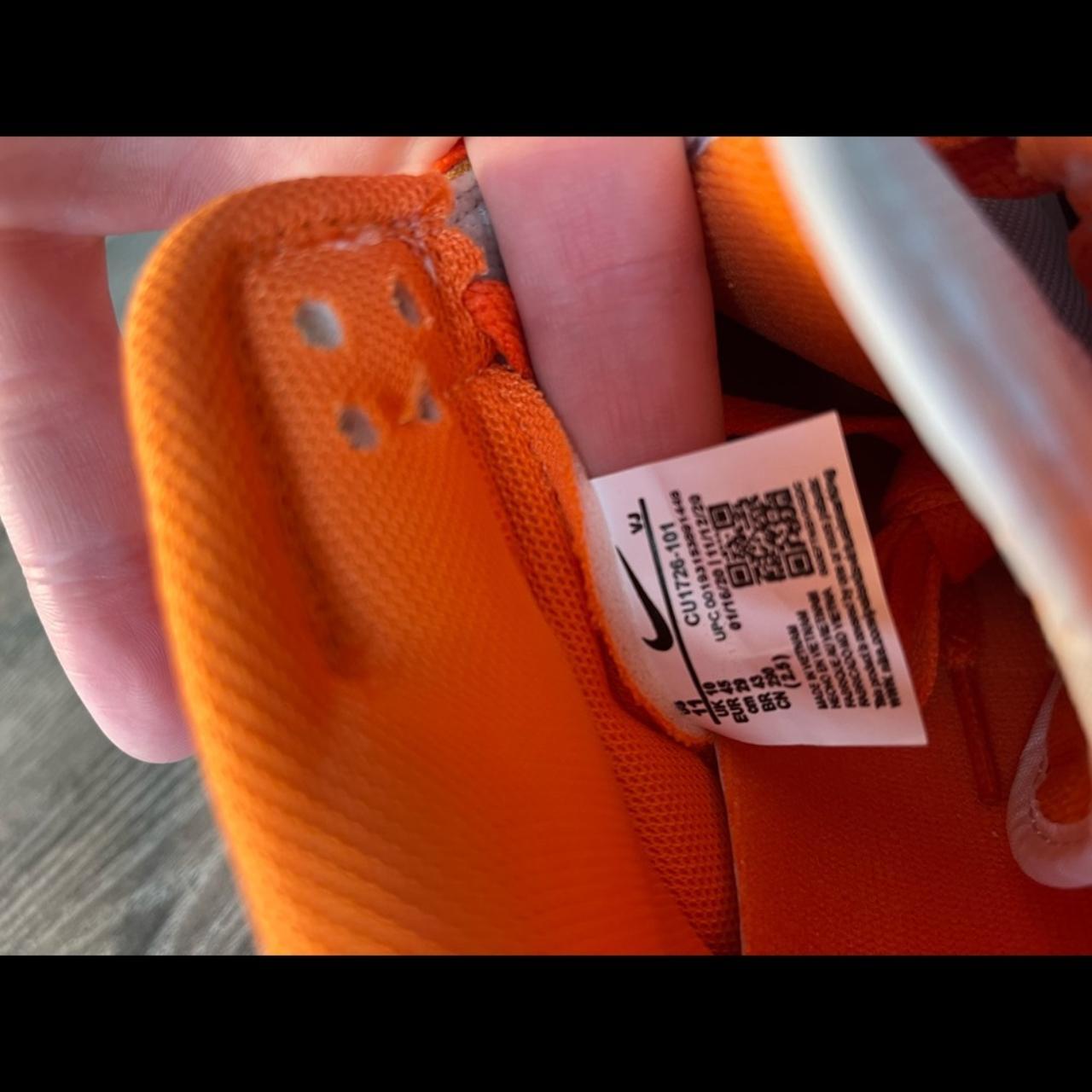 orange tag on nike shoes