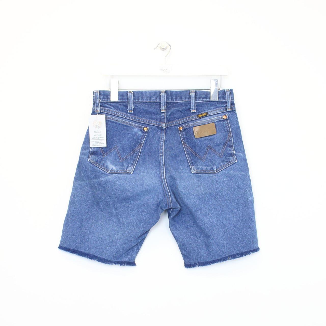 Vintage Wrangler cut off shorts in blue. Best fits... - Depop