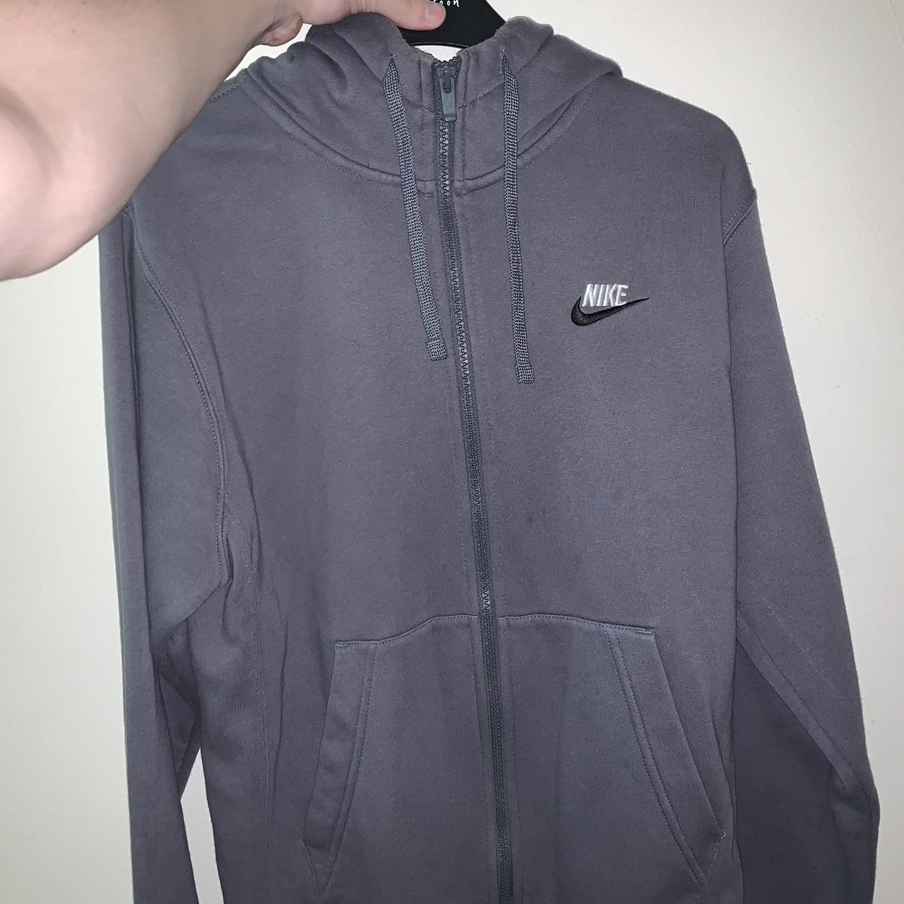 Dark grey Nike hoodie, worn a fair amount. Size... - Depop