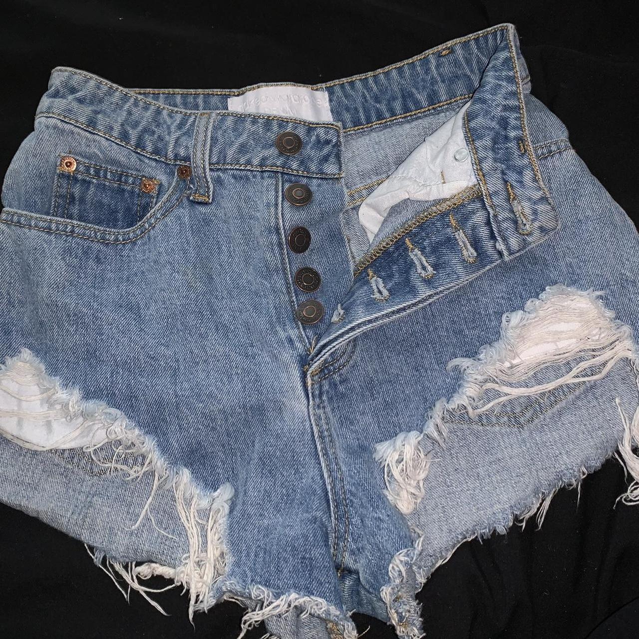 Naked Wardrobe distressed blue high wasted denim... - Depop