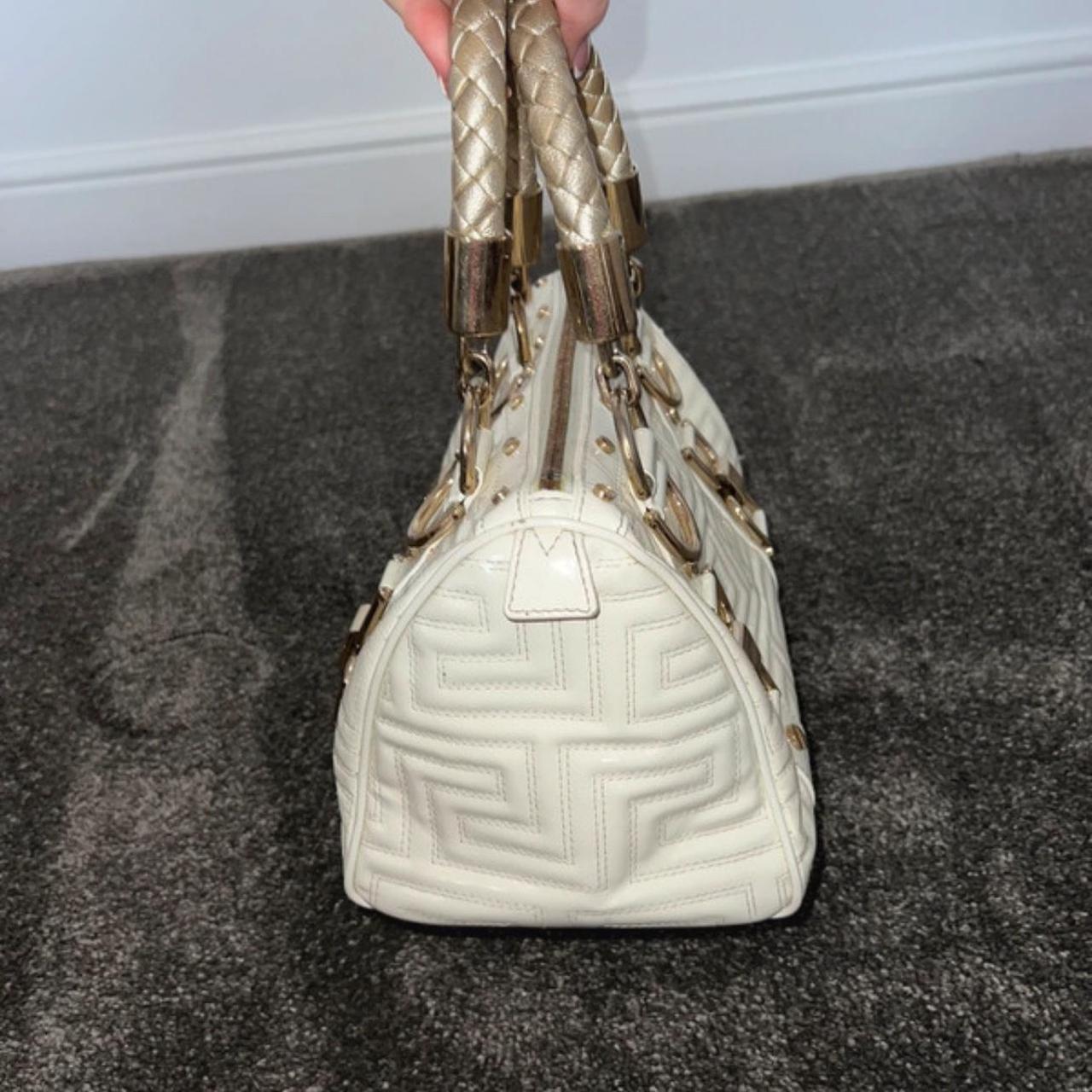 Authentic Gianni Versace white quilted patent leather “snap