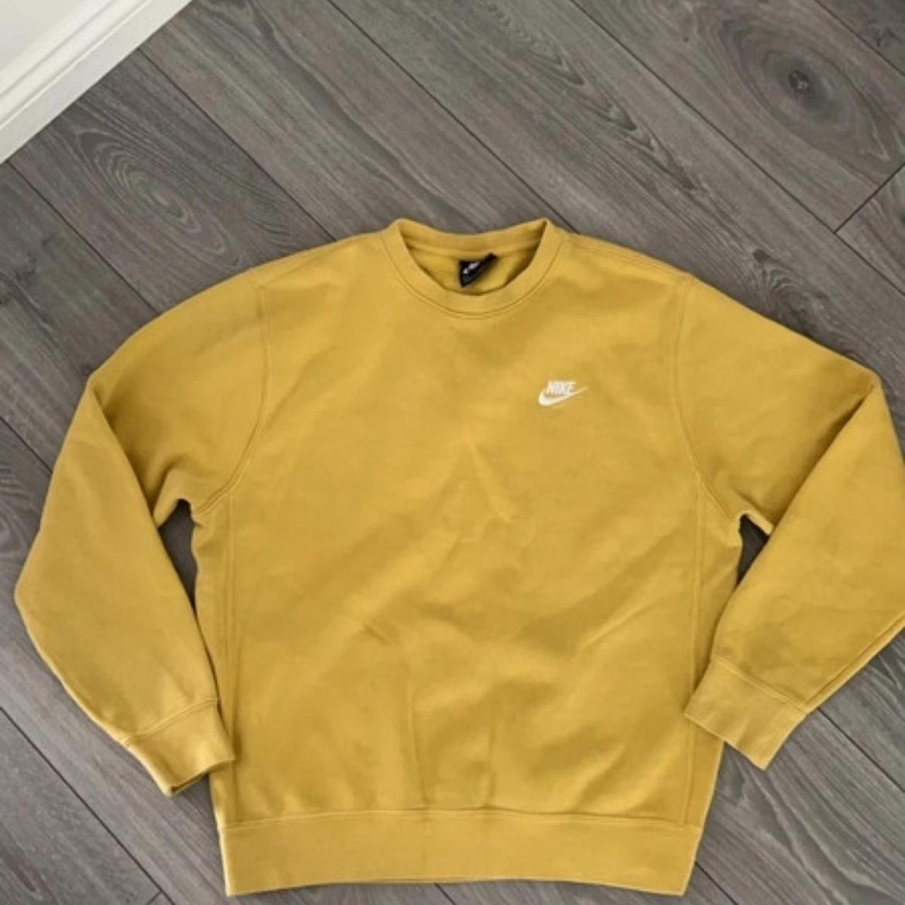 The used Nike yellow crew neck sweater is a