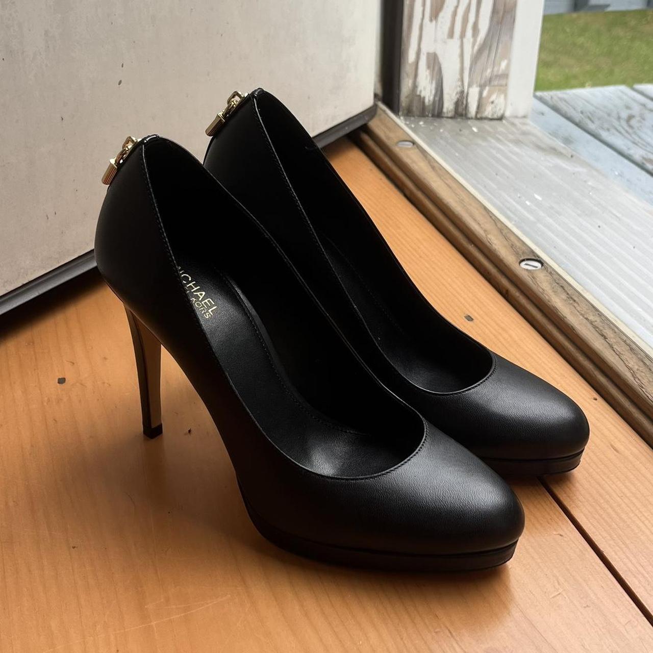 Michael Kors black high heels with gold detailing in. Depop