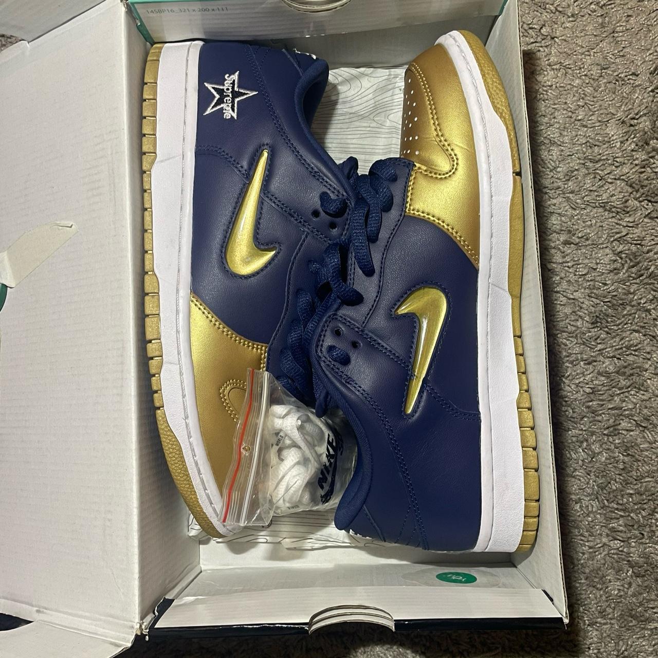 navy and gold nike trainers