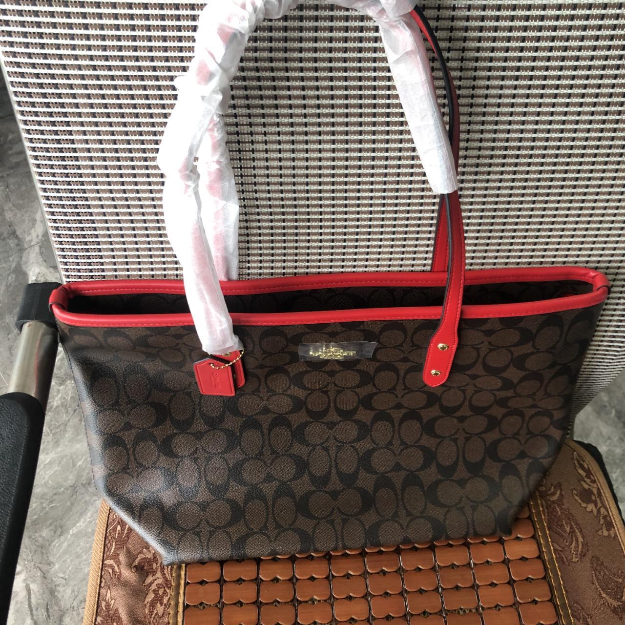 City zip tote in signature canvas coach deals