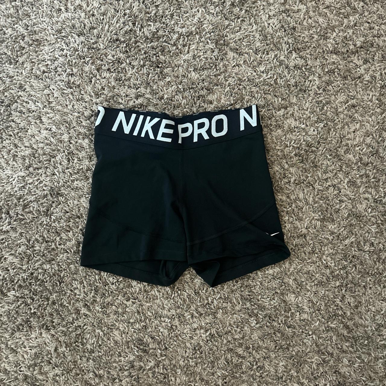 nike pros size m , 2 tiny holes in the butt