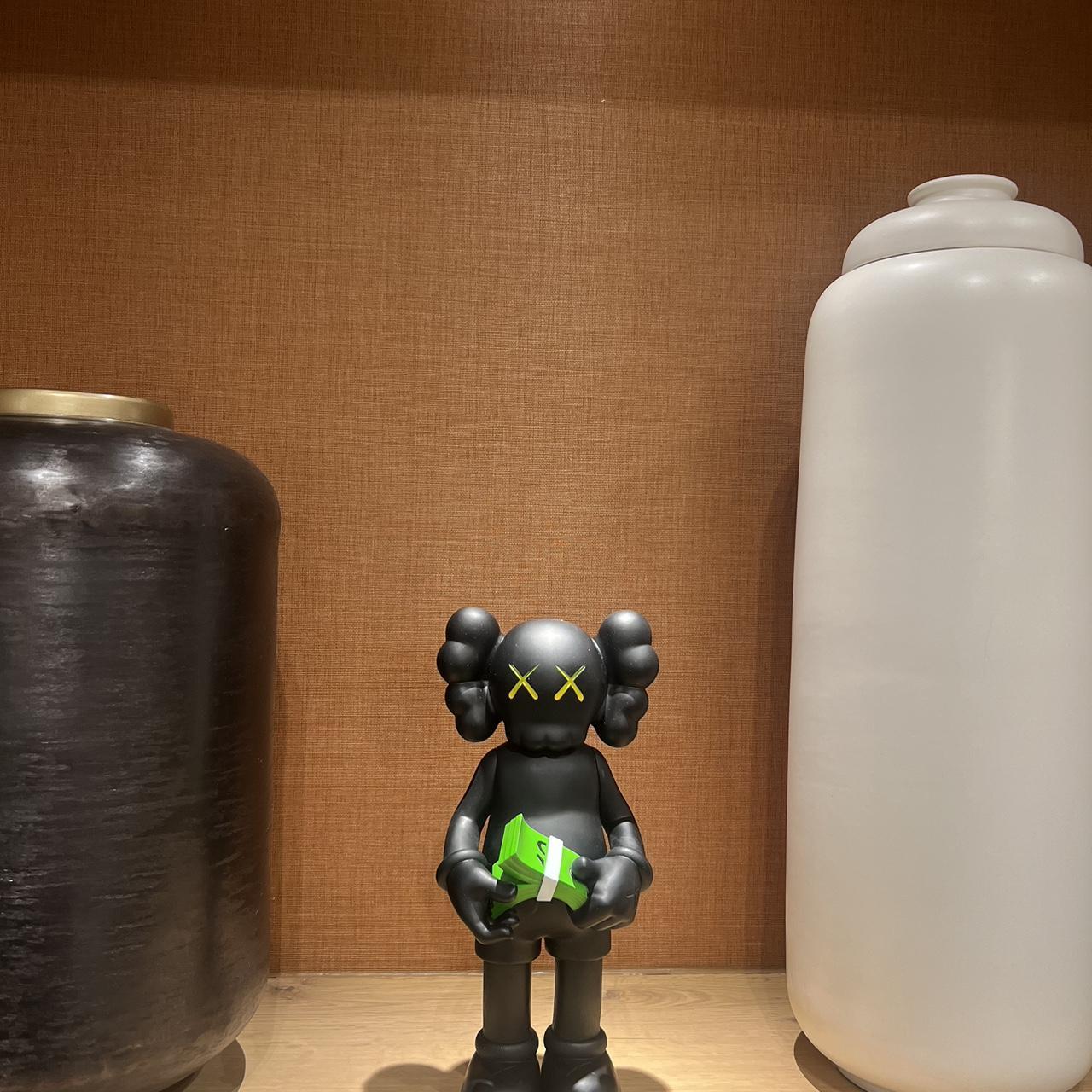 This 30cm Black Kaws Cash Figure is a must-have for | Depop