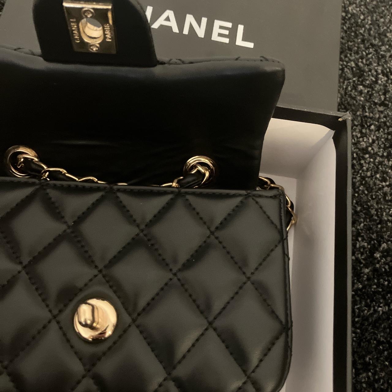 Beautiful black “Chanel” bag with gold accents.... - Depop