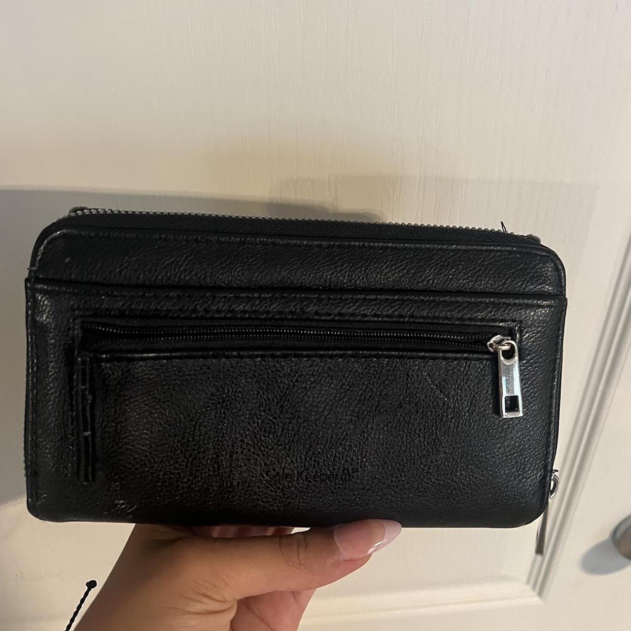 Black and silver wallet with a few scratches on