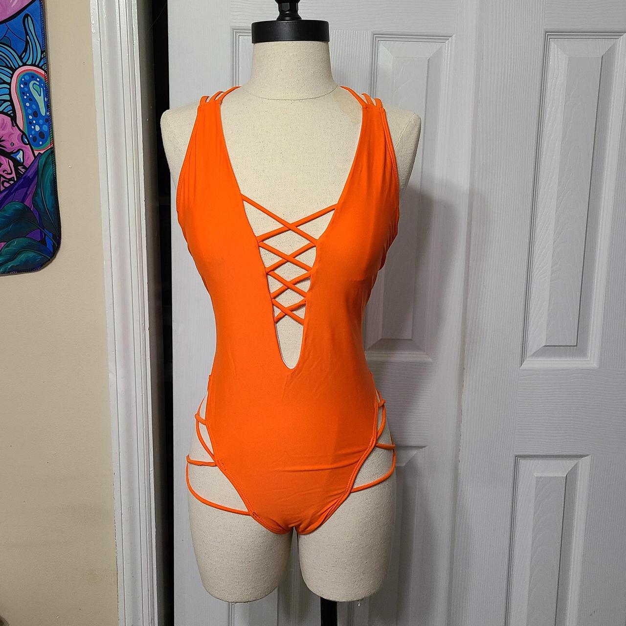 Medium neon orange one piece swimsuit. Free gift