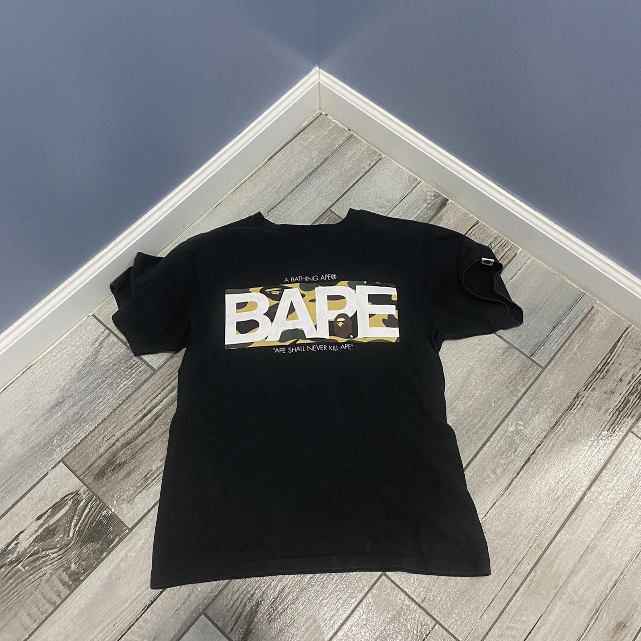 Black orders and gold bape shirt