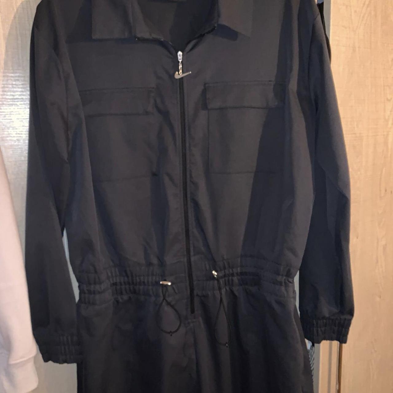 nike swoosh utility jumpsuit in black