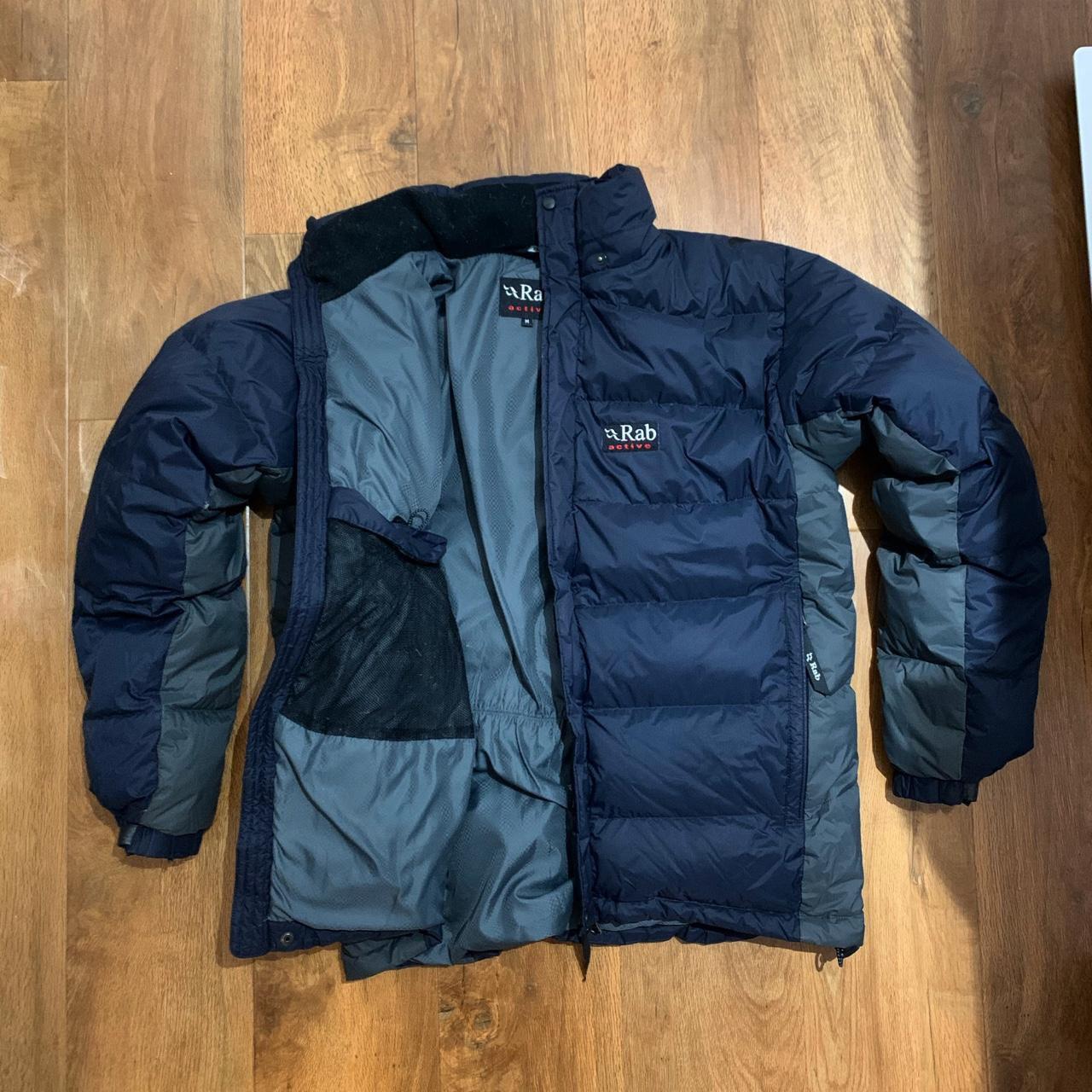 Two tone Rab puffer. Good used condition in... - Depop