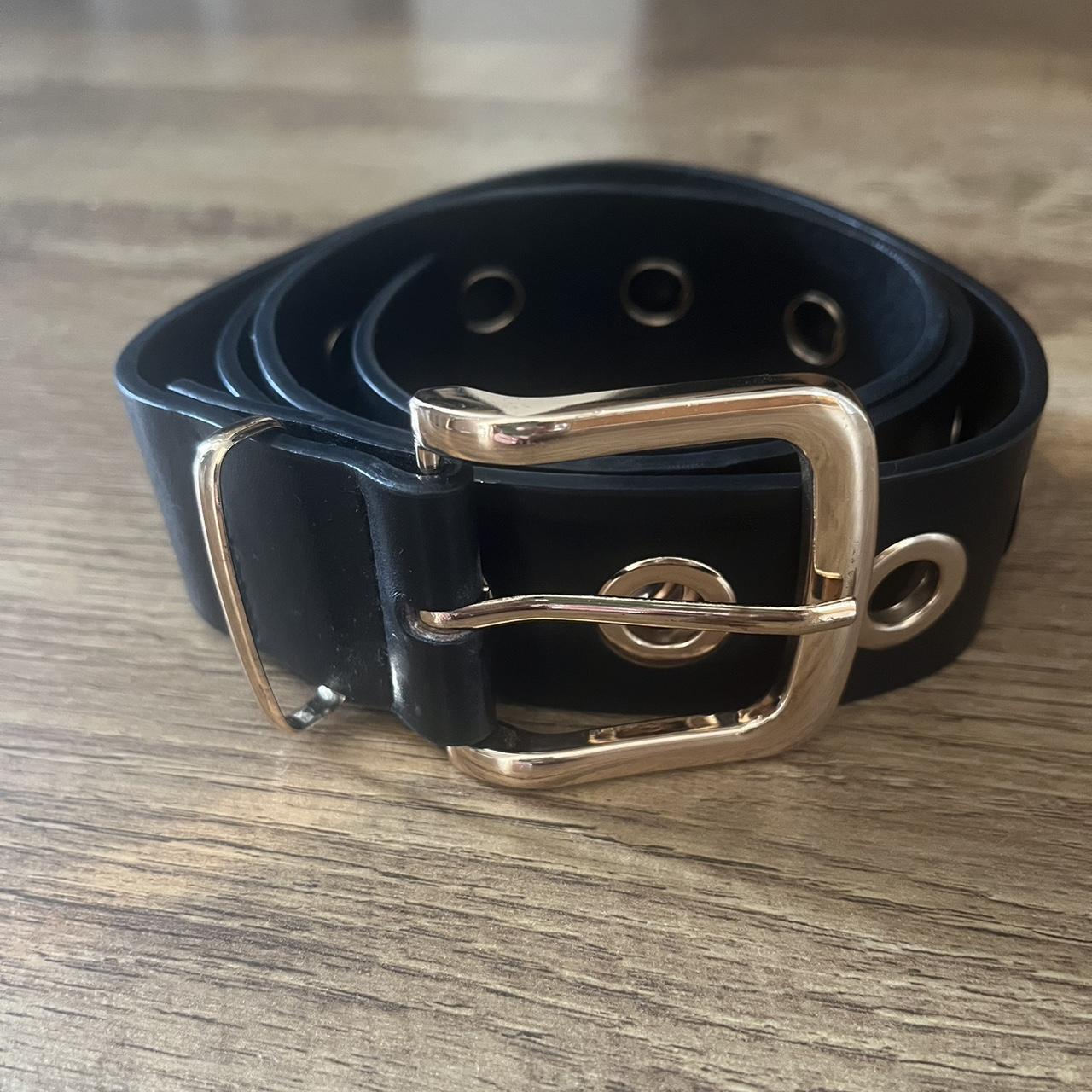 Wide black belt with gold buckle. Few scratches on... - Depop