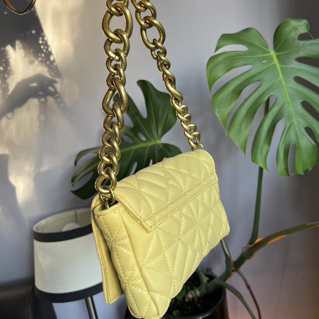The iconic Zara chain purse in a light yellow. Such... Depop