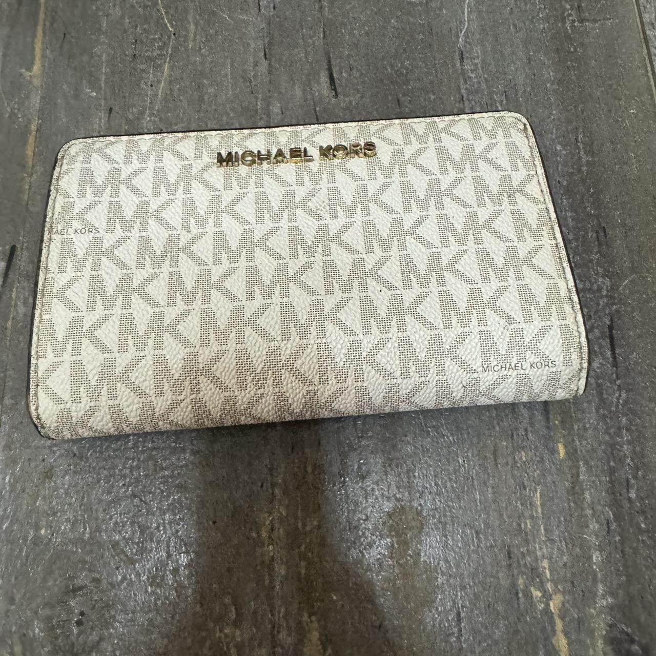 This Michael Kors folding wallet in white PVC is a. Depop