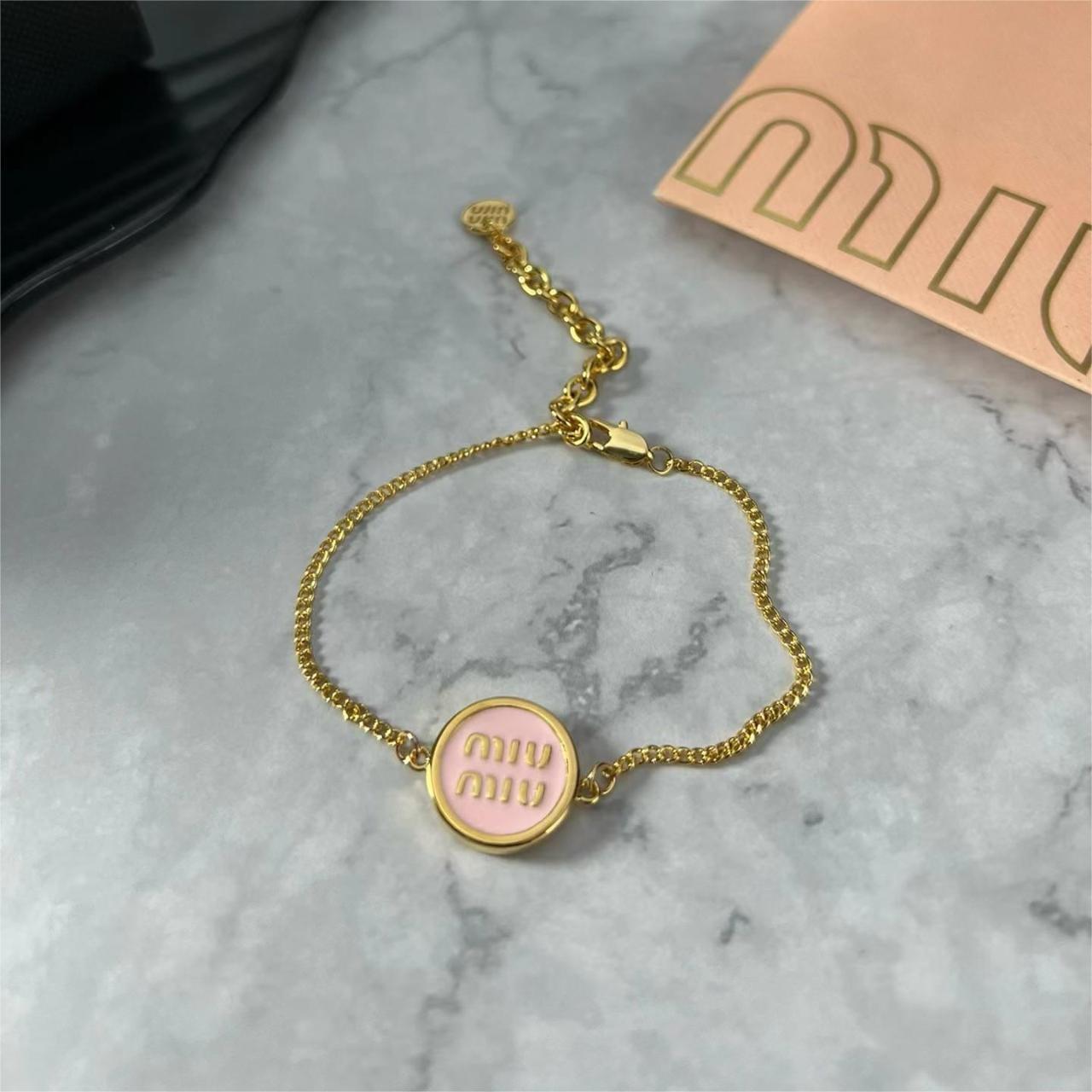 Miu Miu Women's Metallic Enameled Metal Bracelet | Depop
