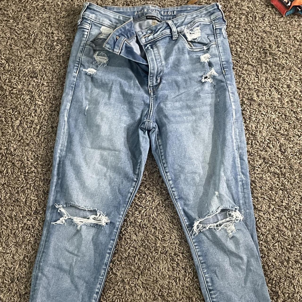 light denim jeans w/ rips and fringe