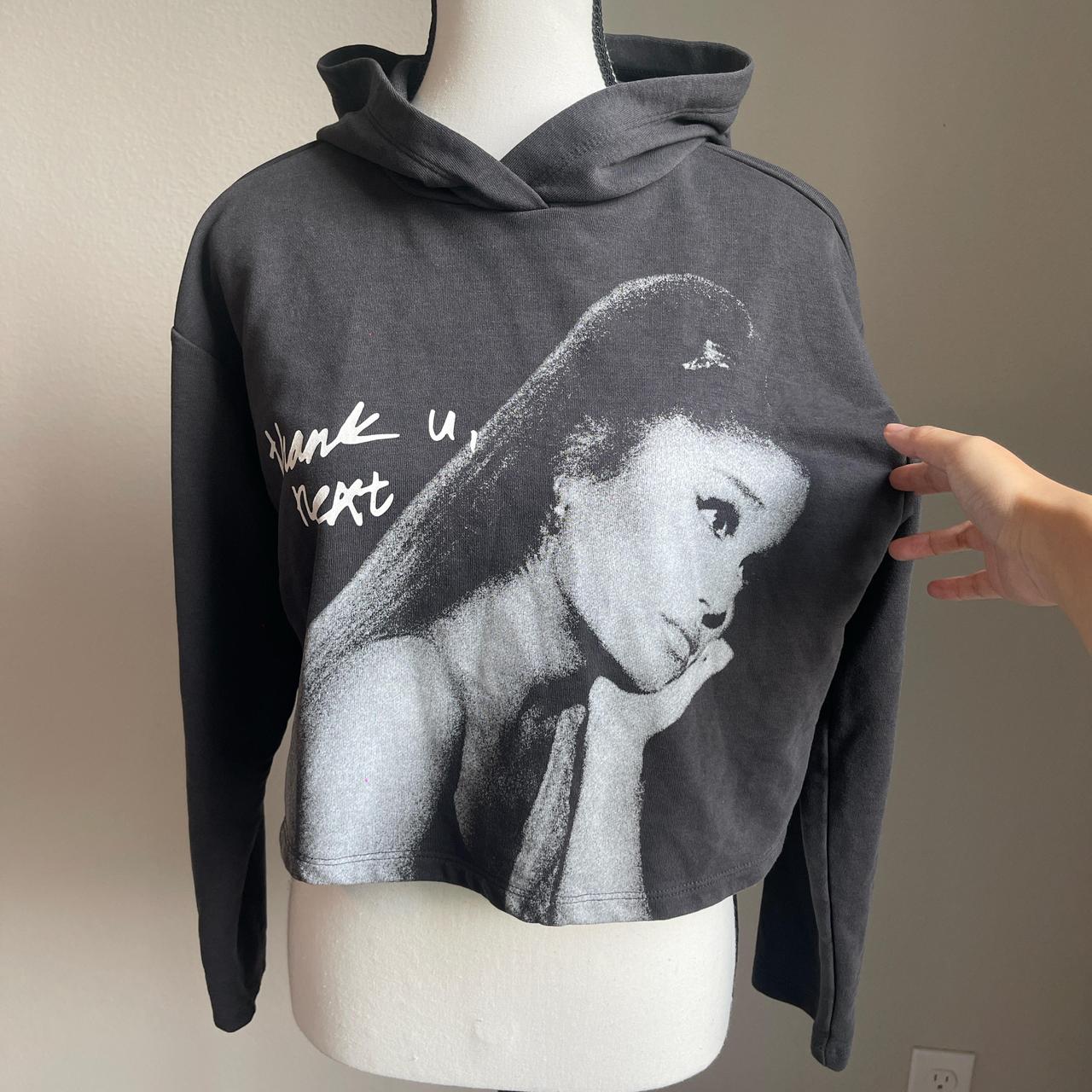 Ariana Grande black cropped hoodie with a graphic. Depop