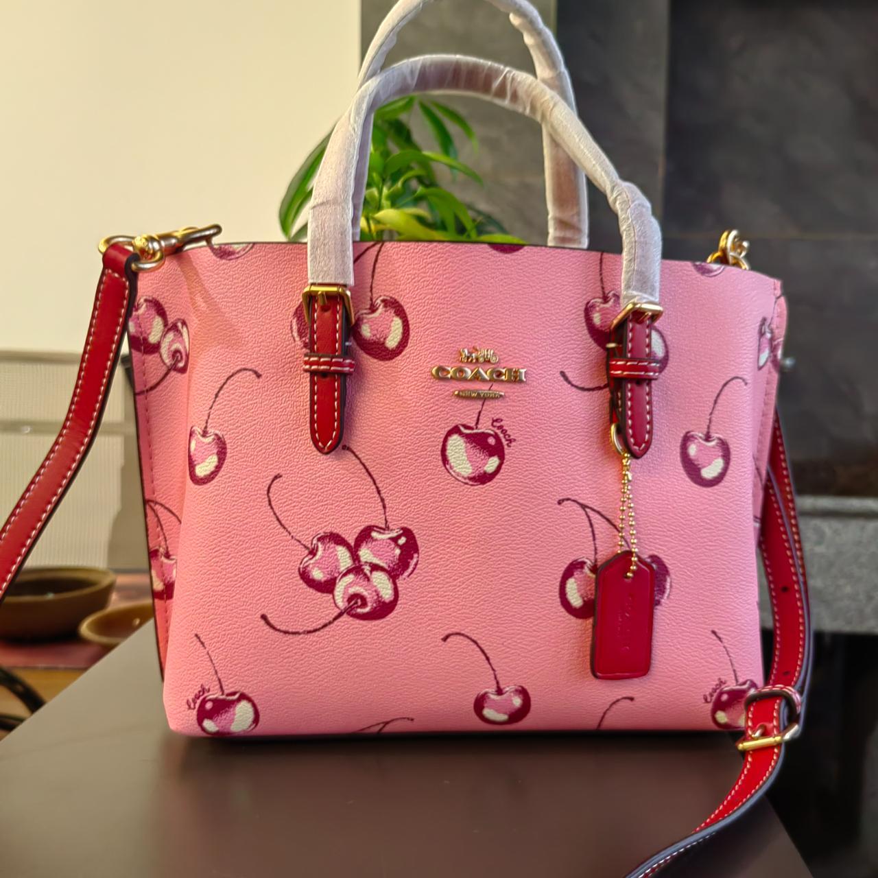 Discover the Coach Mollie Tote Bag 25 with Cherry Print: A Stylish Choice for Every Occasion