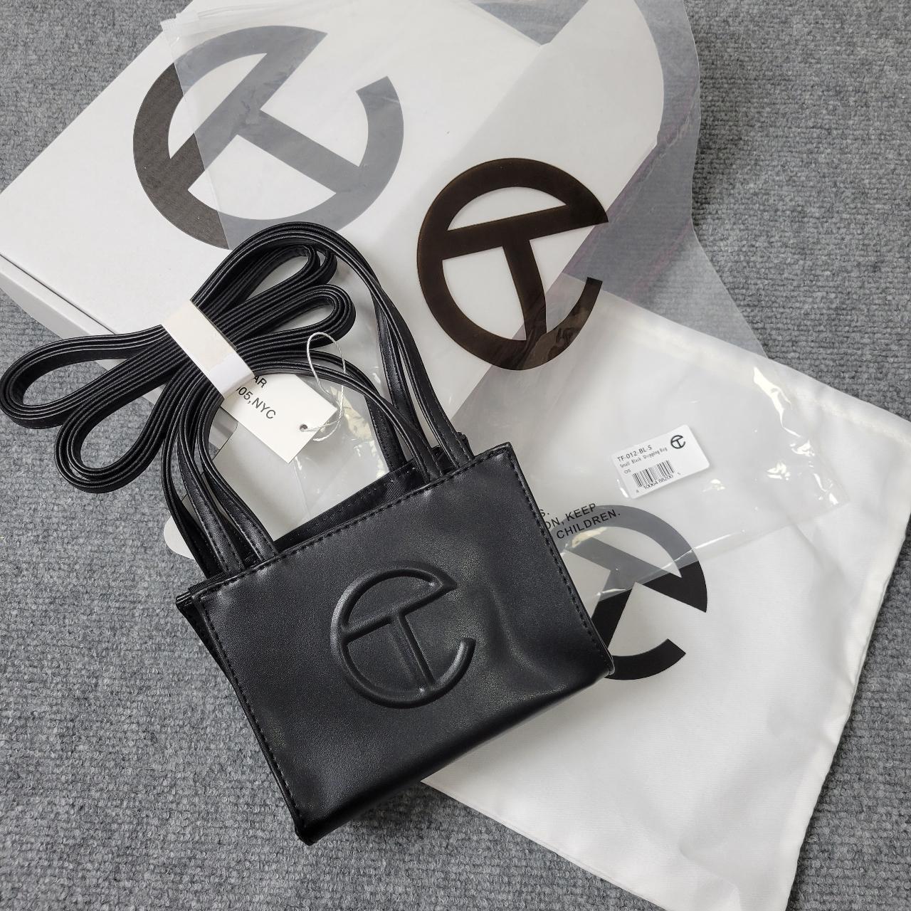 TF selling small black shopping bag