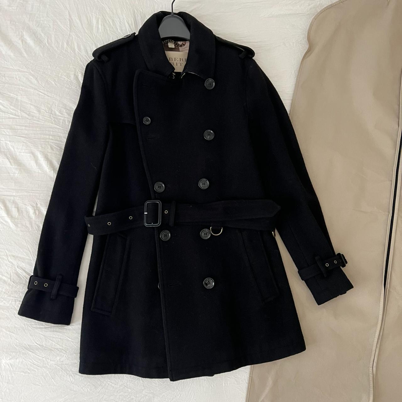 This double-breasted black Burberry trench coat is... - Depop