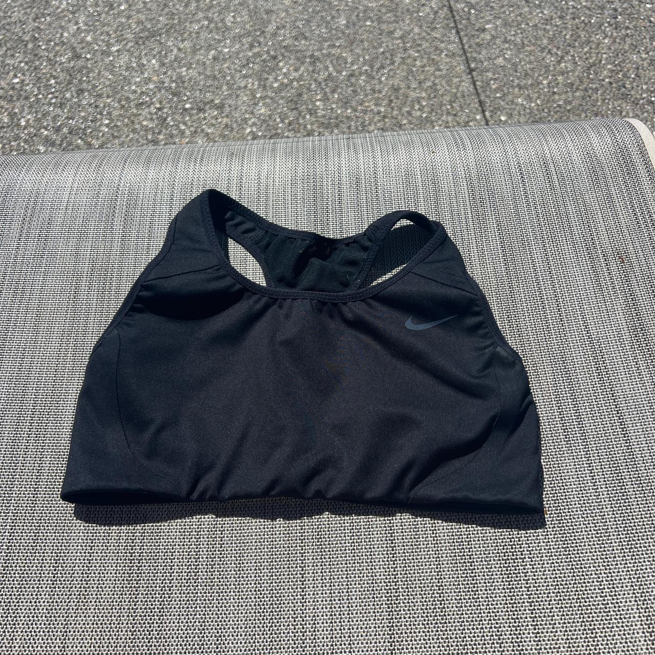 Black Nike sports bra. Decent condition. - Depop