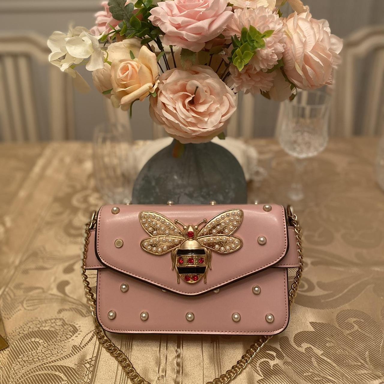 Pink bee embellished hand bag with gold accents. Depop