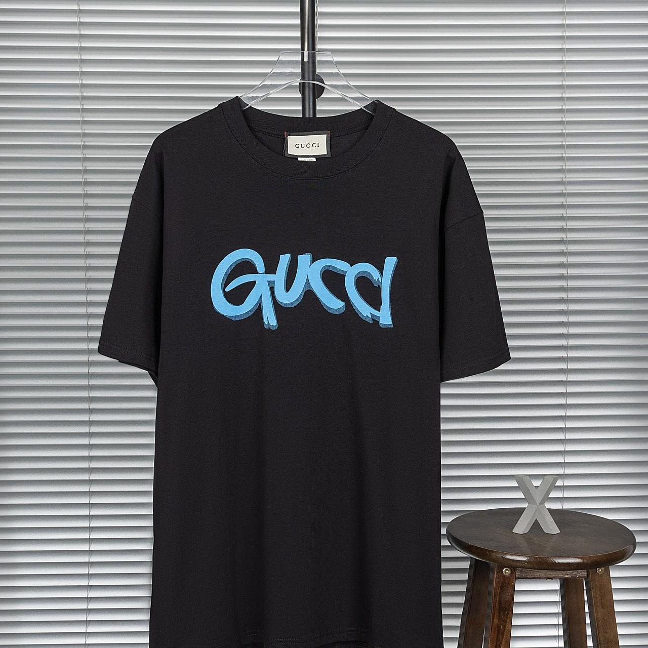 Gucci graffiti shirt on sale