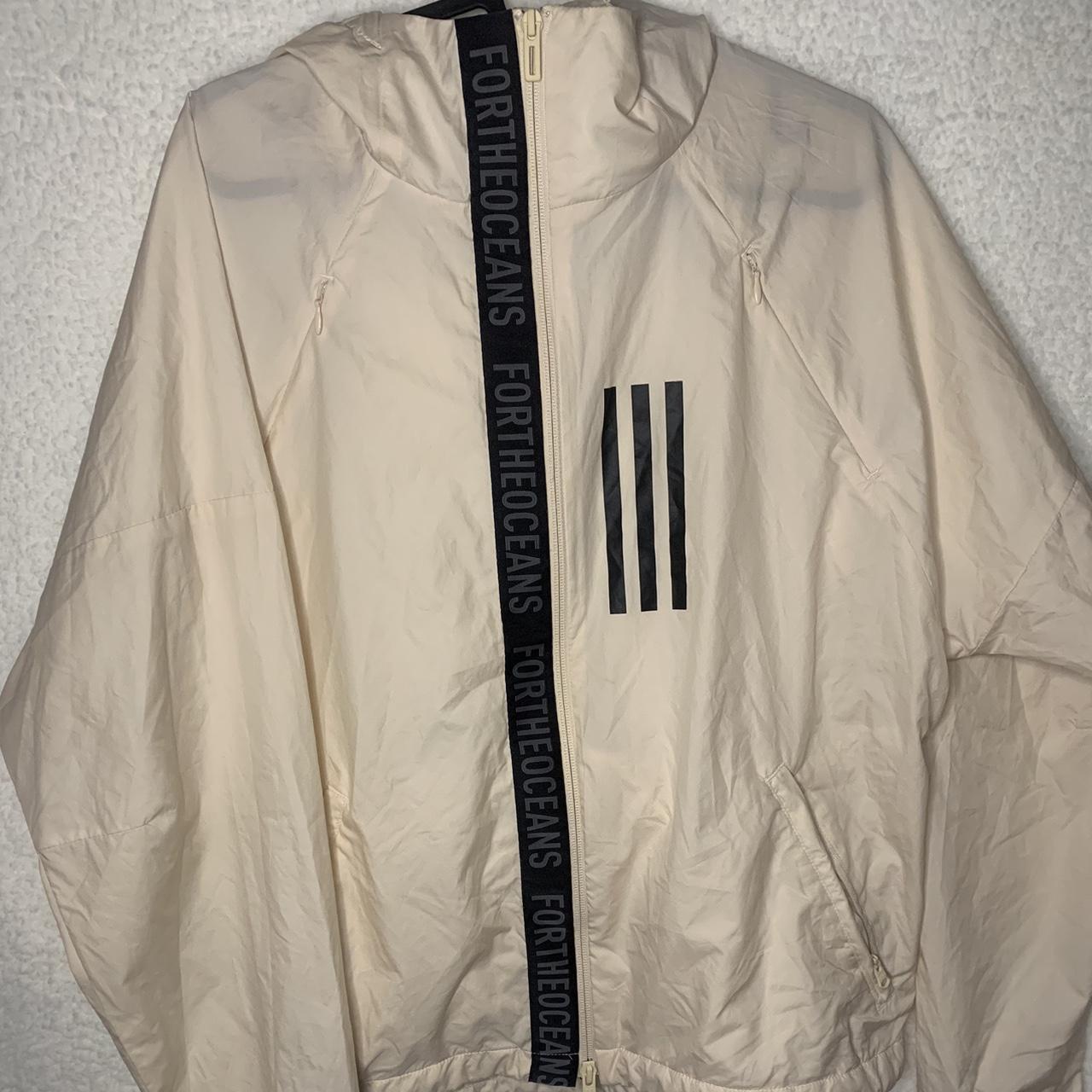 Adidas cream and black windbreaker save the