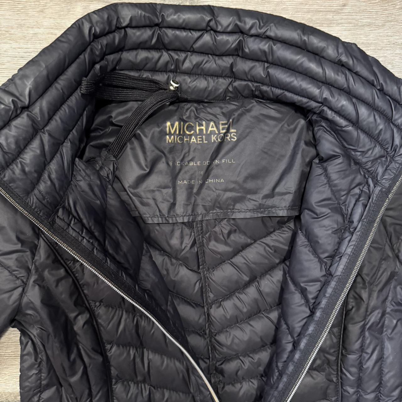 Michael Kors. Black puffer jacket with gold zippers... Depop