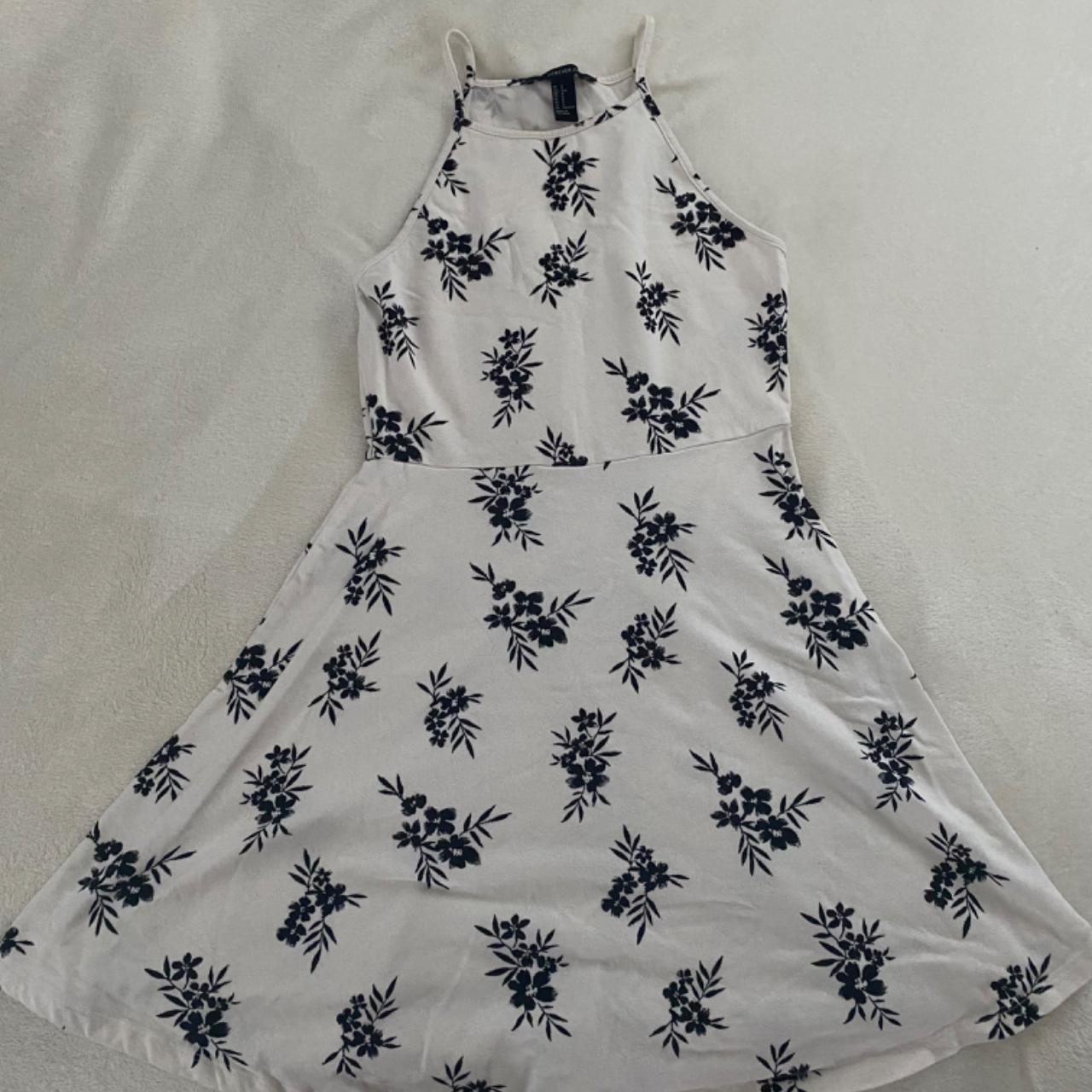 white halter neck skater dress with black flower